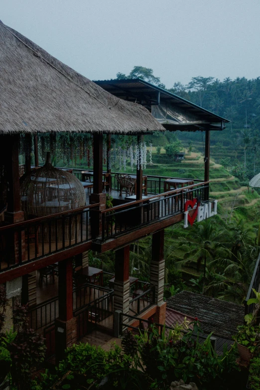 the top portion of a building with a thatched roof