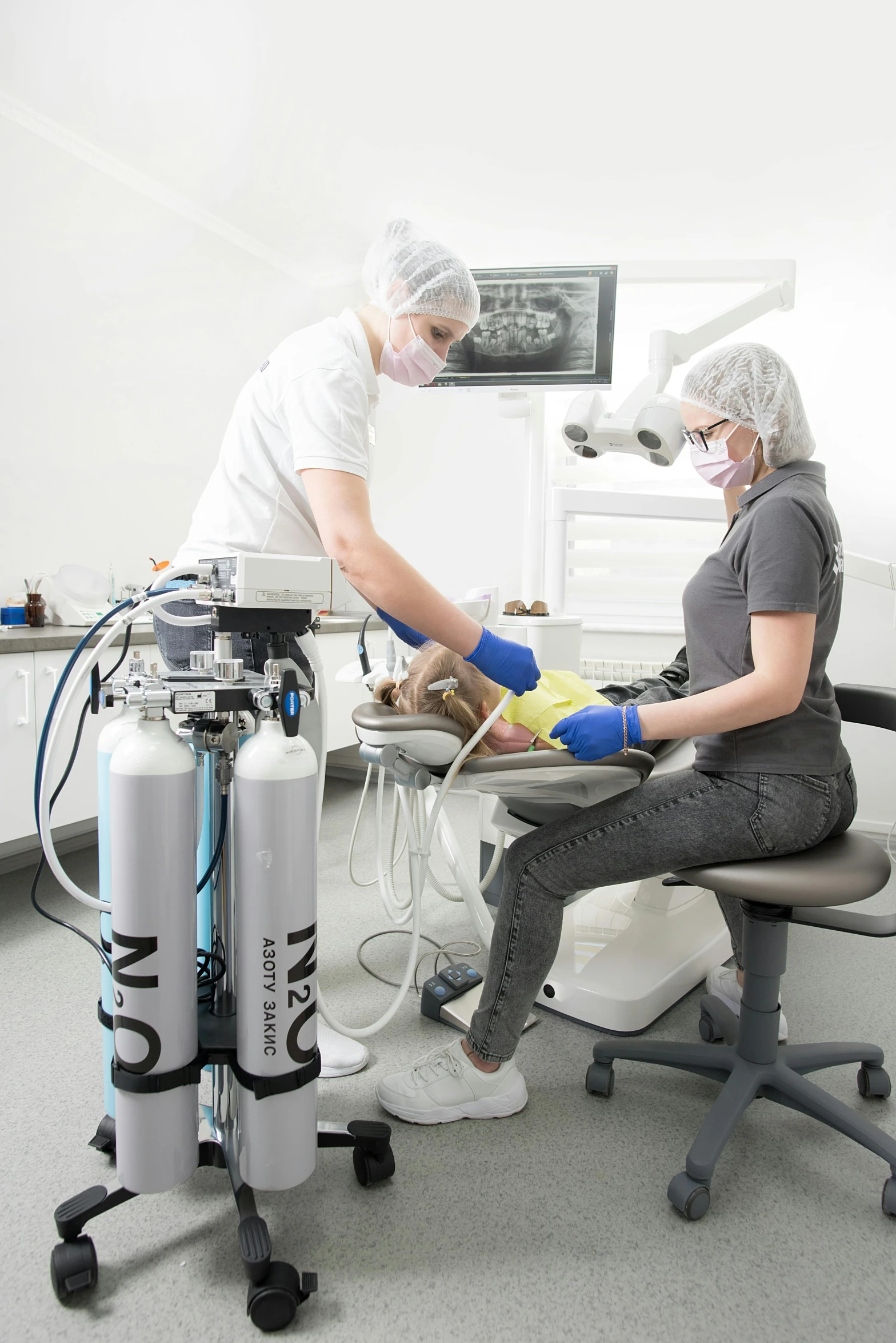 an older man and a younger woman in operating room