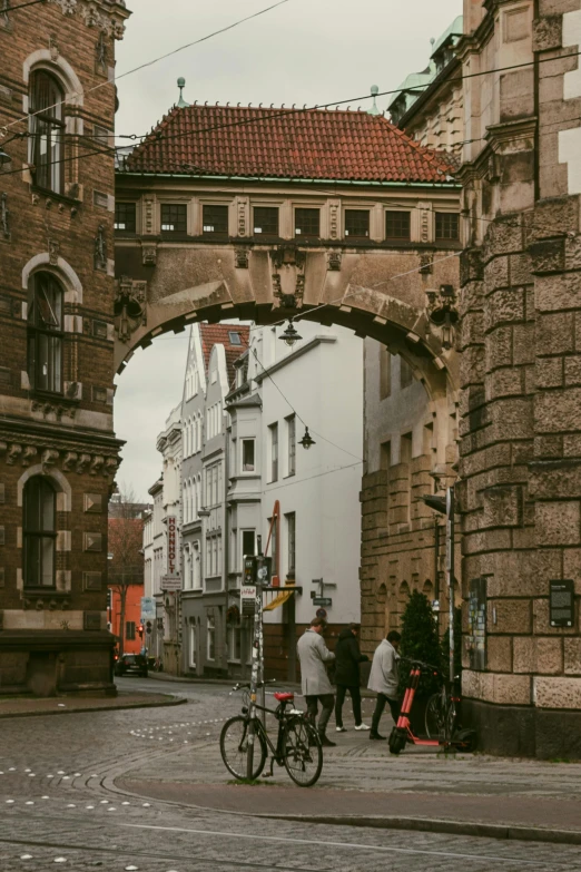 a group of people walking across a city street