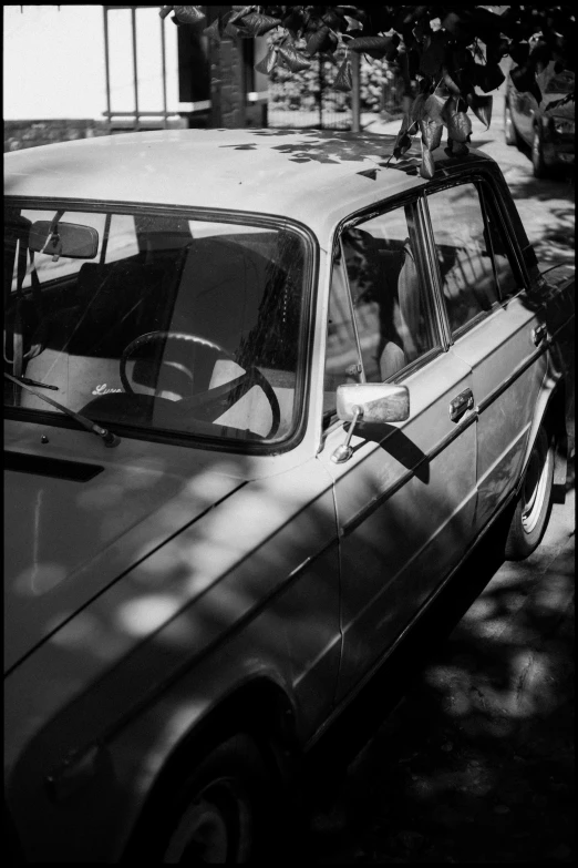 a man leans out of his car window