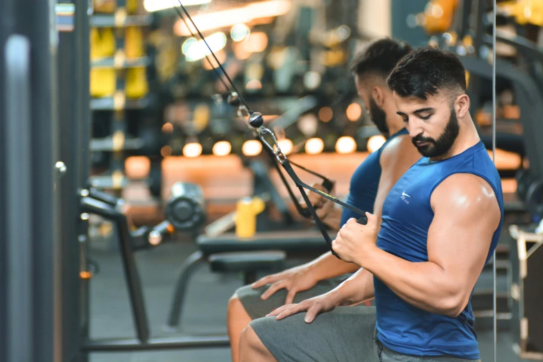 a man working on the chest with cable and pull ups in the gym