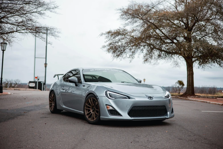 a toyota car is parked in the middle of the street