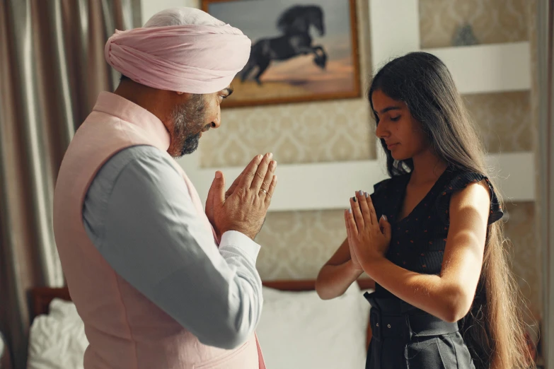 two people sitting together and clapping