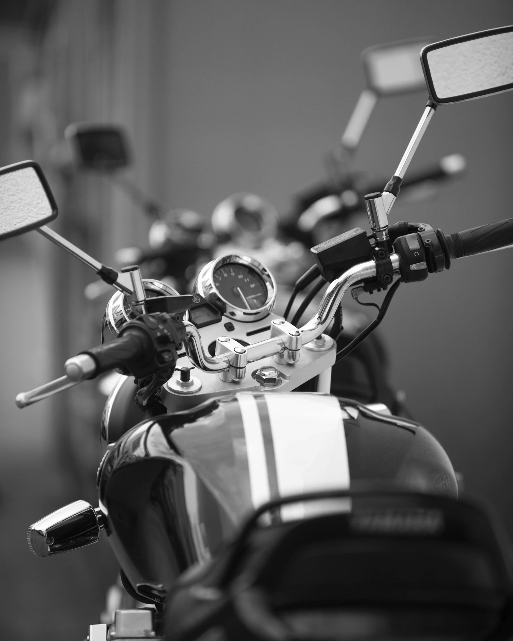 black and white pograph of a motorcycle handlebars