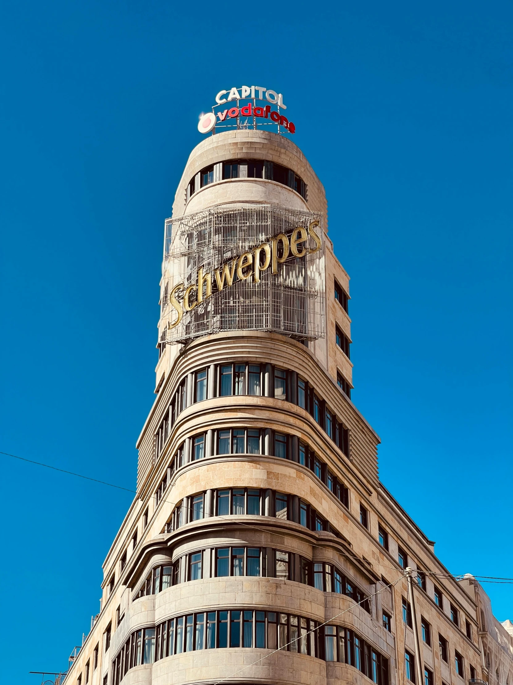 a very tall building with many windows and clock tower