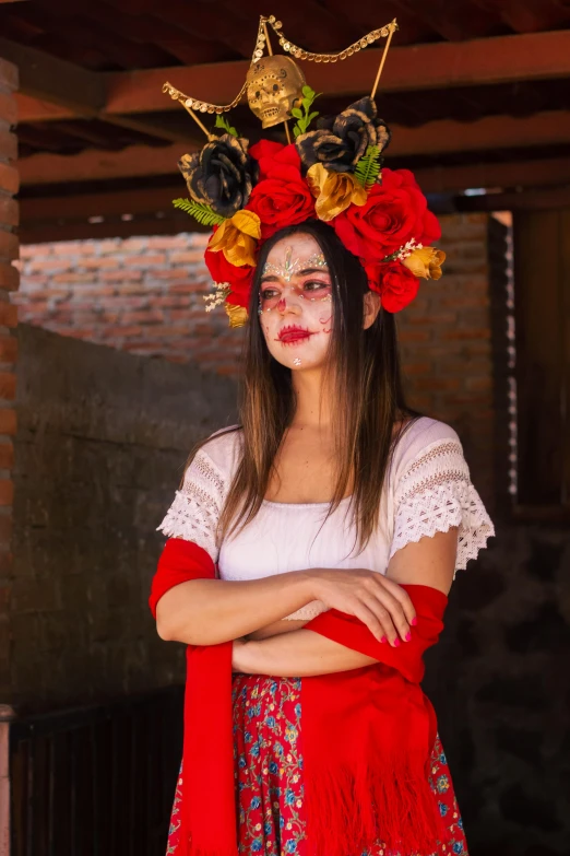 a girl is in costume with a flower crown on her head