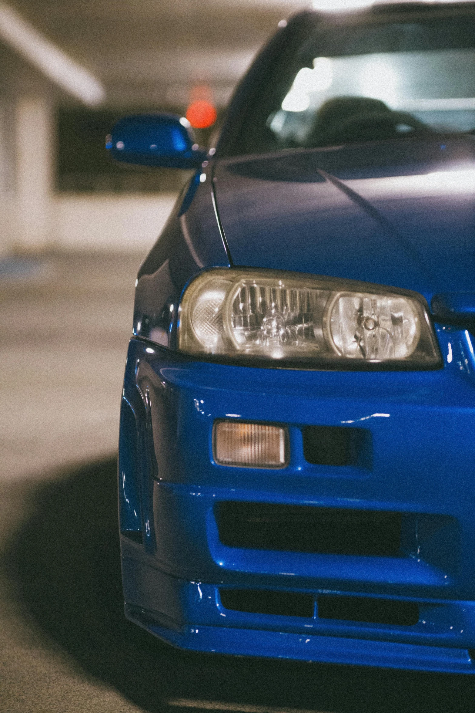 a blue car is parked in a parking space