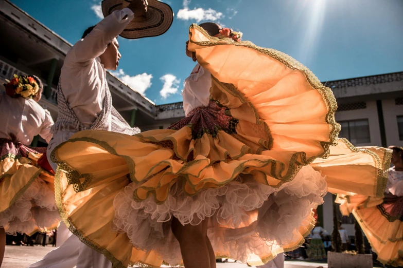 a couple of dancers that are standing in the street