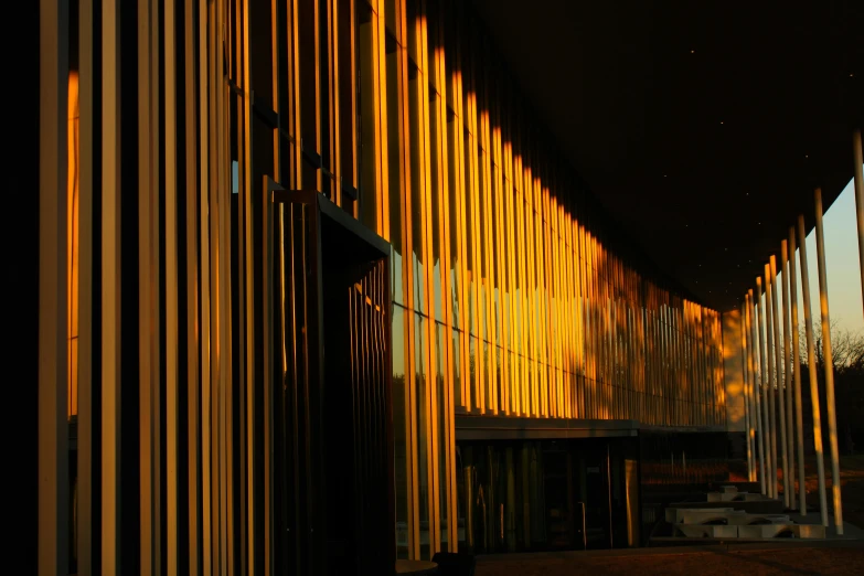the light of the building appears to be reflected on the wall