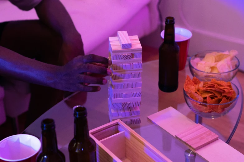 a person holding some food on a table