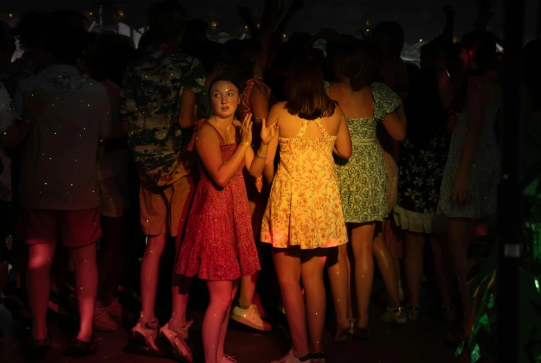 young women in bright dresses dancing at a party