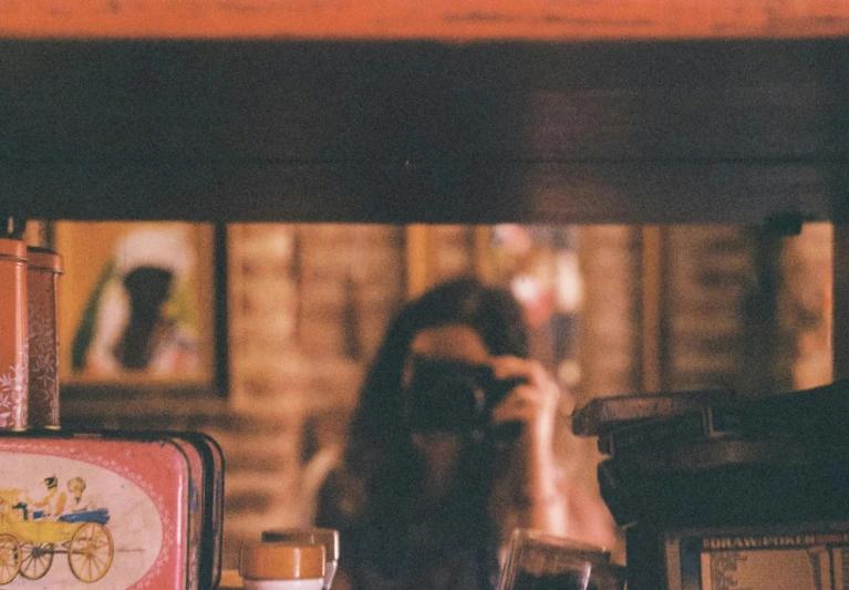 a close up of a glass and some items on a table