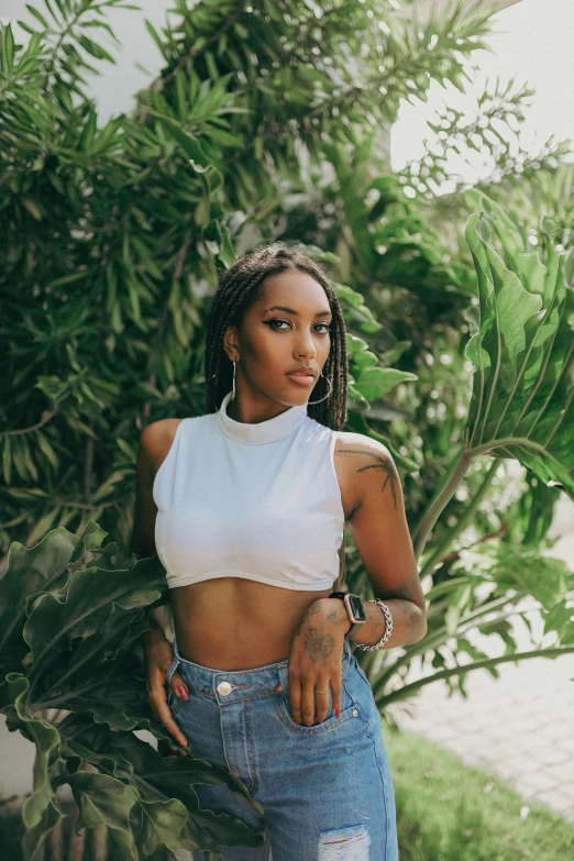 a beautiful black woman wearing a white top