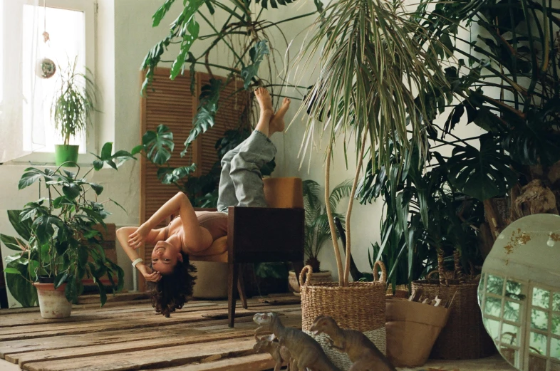 woman in a large room doing an upside down