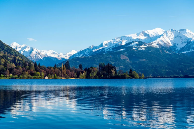 a lake with a white mountain behind it