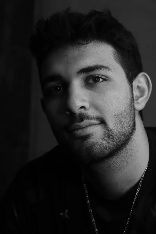 a black and white po of a young man looking to his left