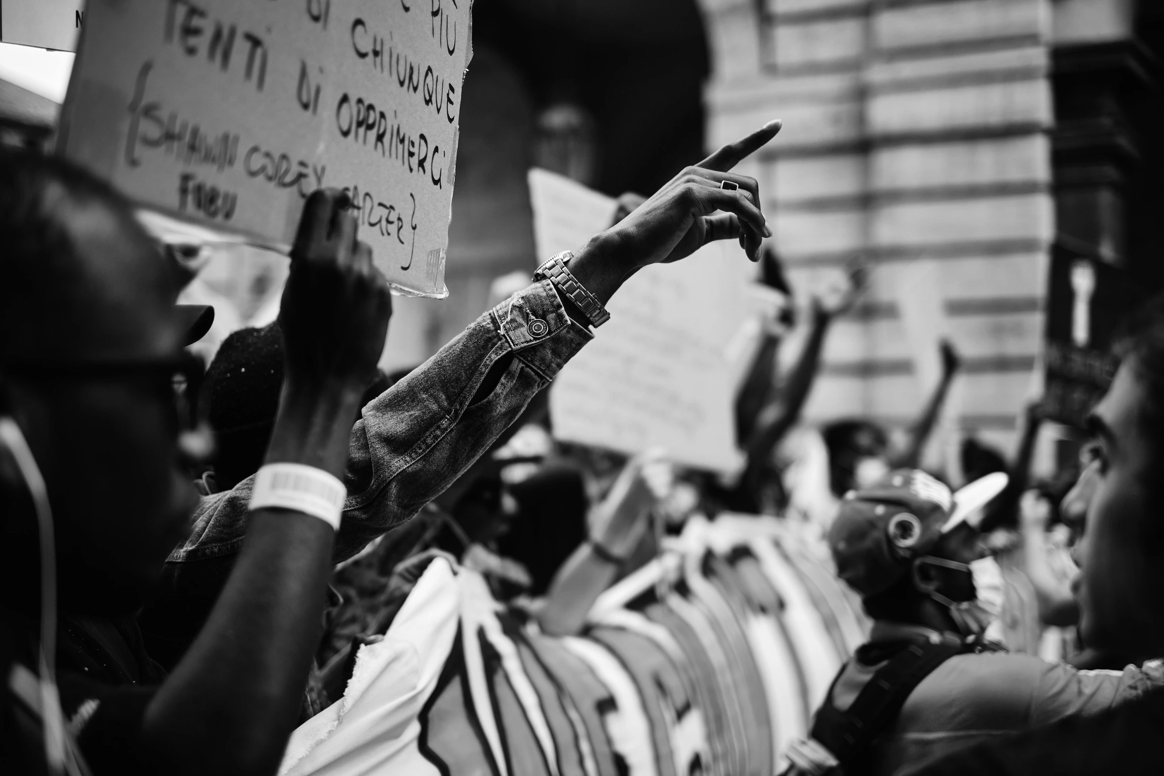 many people are holding up signs in protest