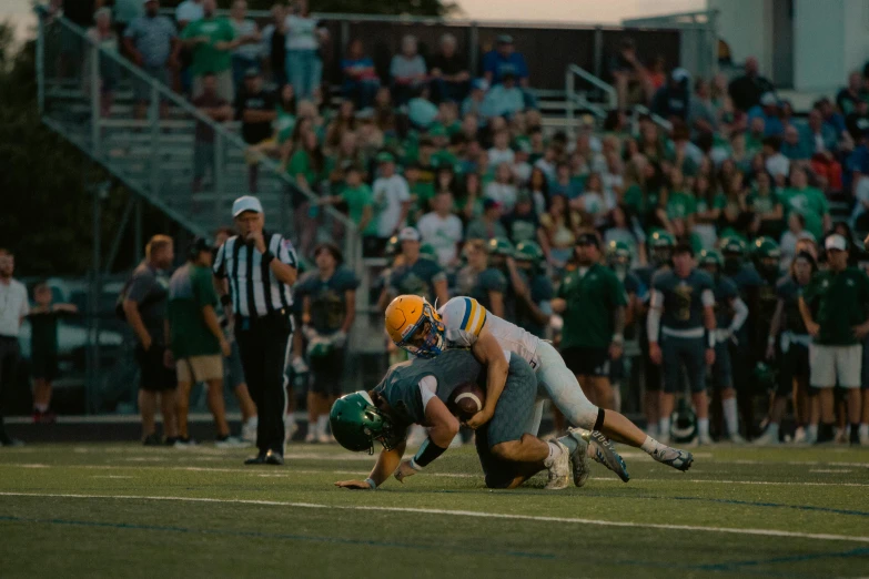 a football player is laying down on the field