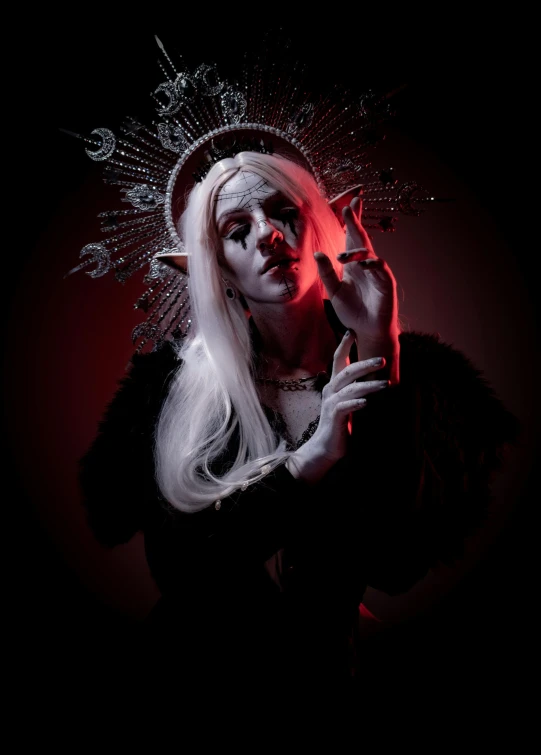 a close - up of a woman smoking a cigarette in a dark background