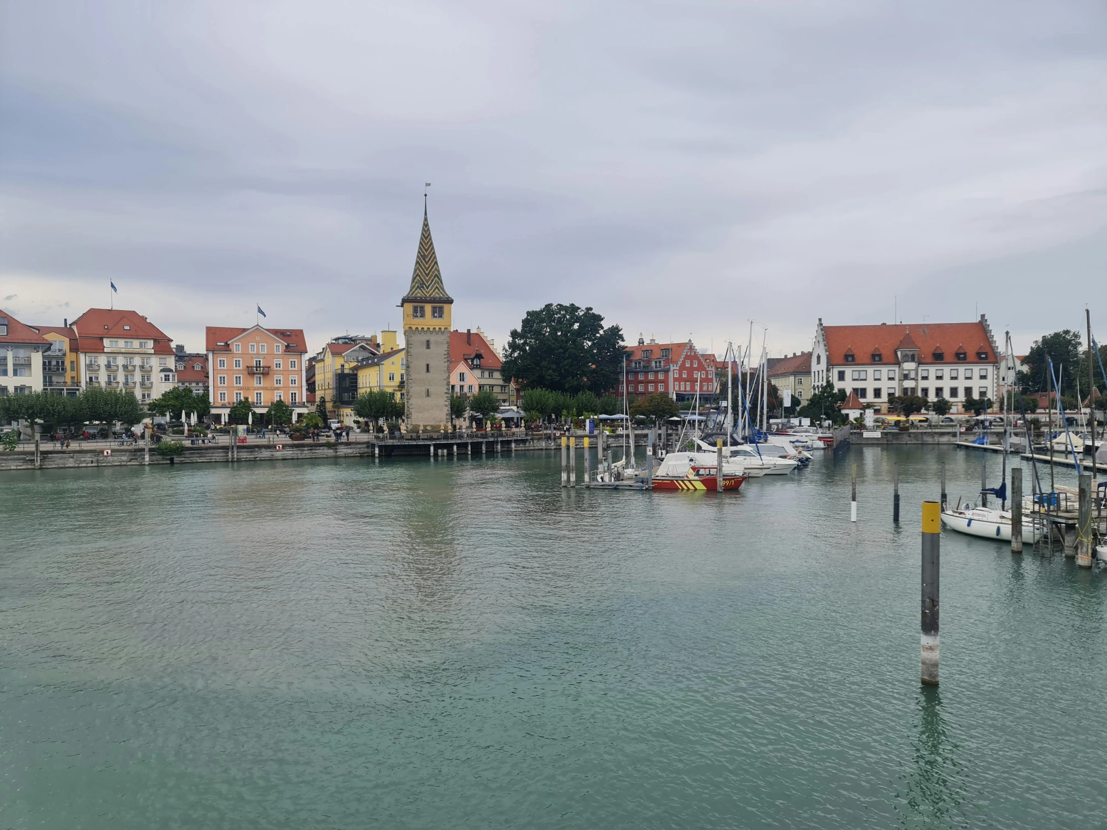 there is a lake in front of some buildings