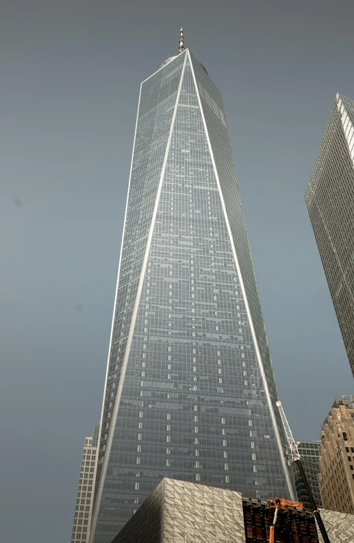 two skyscrs stand tall in the daytime