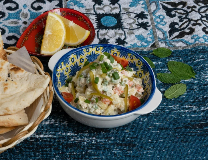 a bowl and bowl filled with food sitting on top of a table