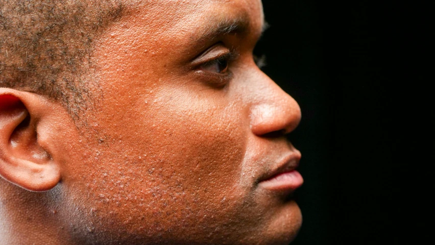 a close up image of a man with his face tilted