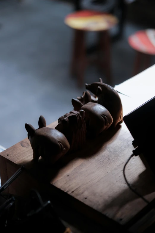 a black statue that is laying on the desk