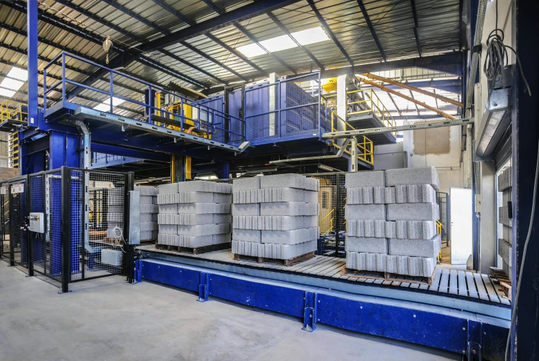 large warehouse filled with a stack of stacks of cement blocks