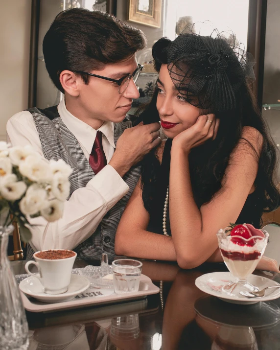 a young man and woman are sharing a laugh