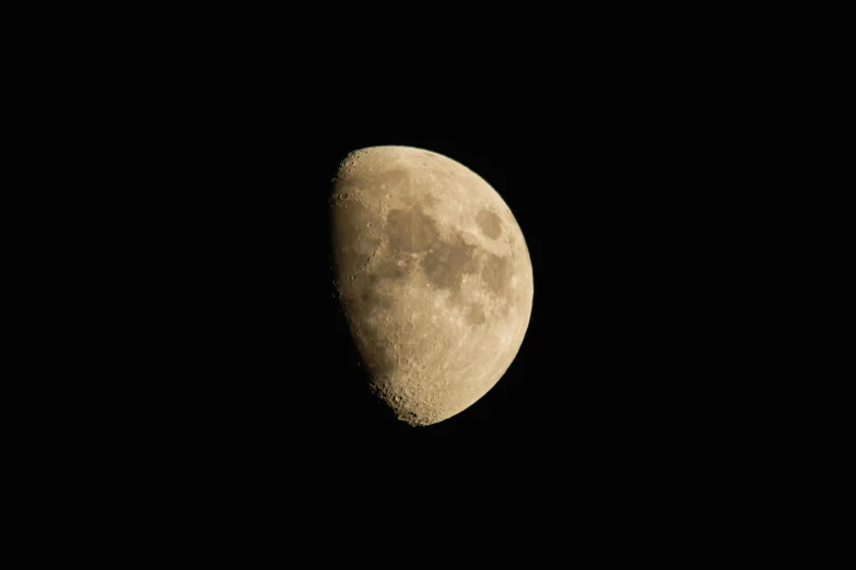 a half moon in a dark sky, with no one on the moon