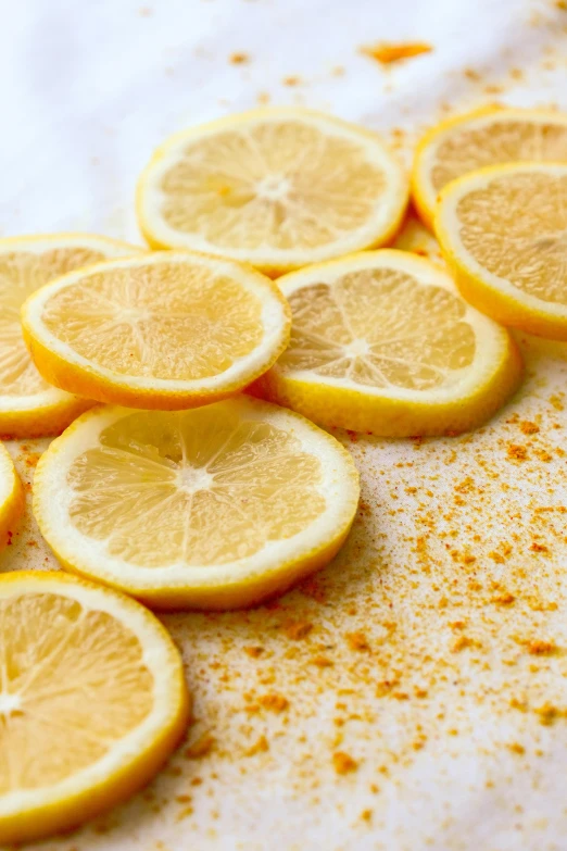 several lemons that are cut in half on the table