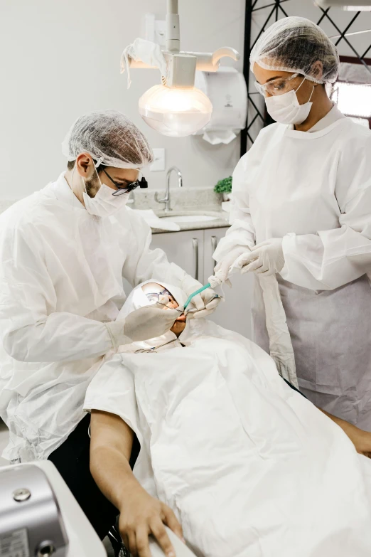 two female doctors preparing for  in the operating room