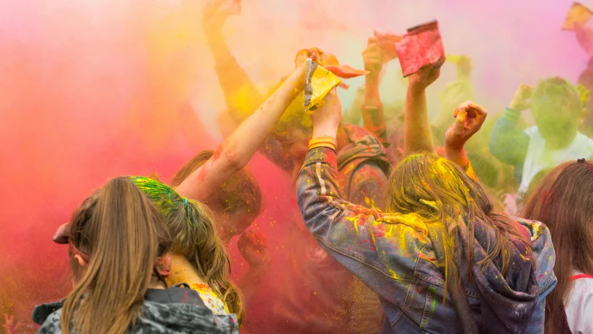 a group of people are celeting the colors of the holi