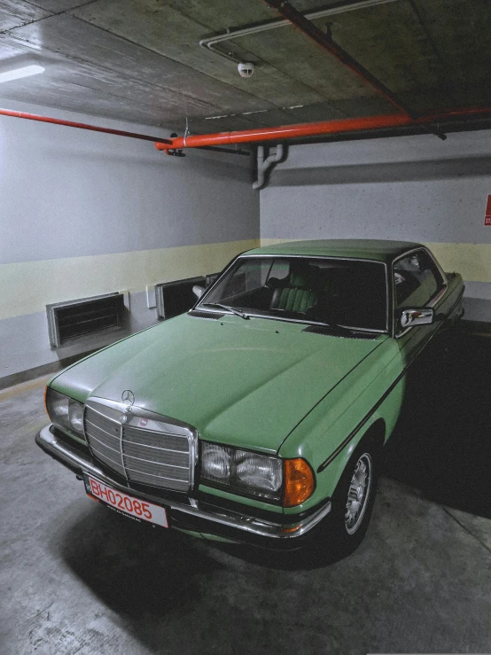 there is an older car that is in a garage