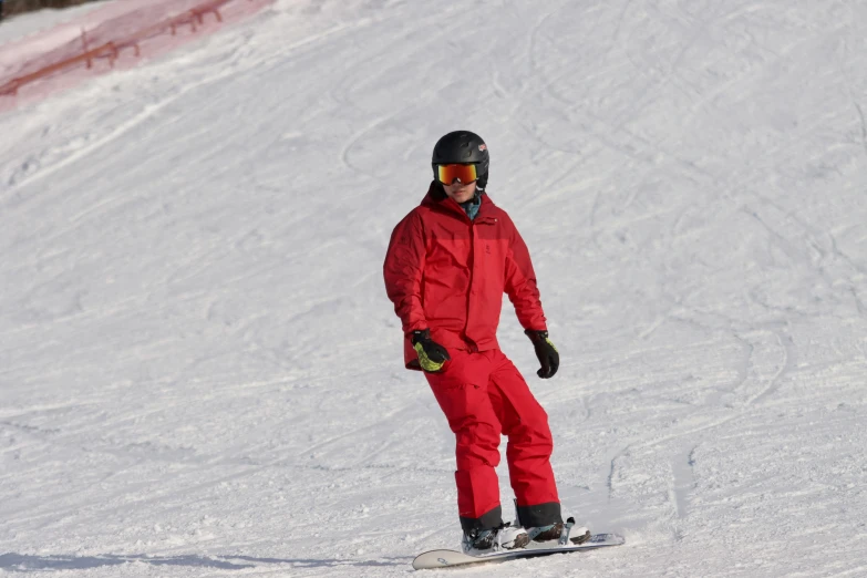 a man riding skis down a snow covered slope