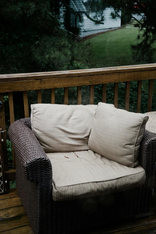 a patio couch sitting on the porch