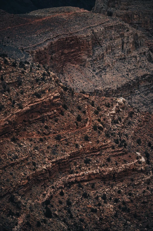 a plane is flying through a barren plain