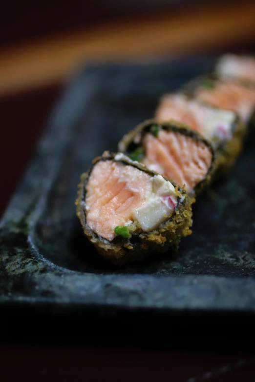 some sushi is arranged on a plate