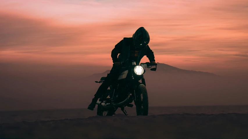 a person is sitting on top of a motorcycle