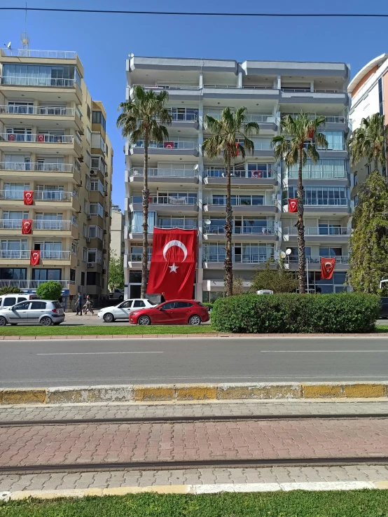 an empty street with cars parked in front