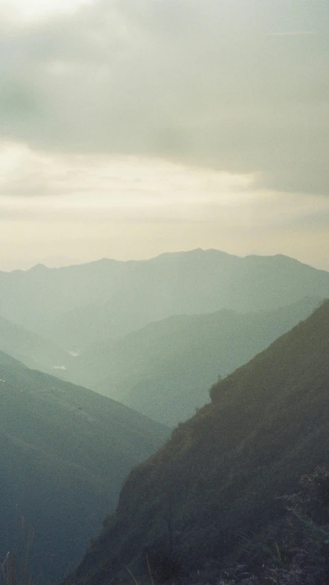 a mountain is shown with some clouds