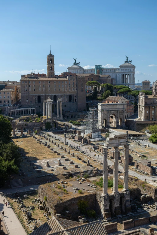 a group of old buildings with a view of a roman forum