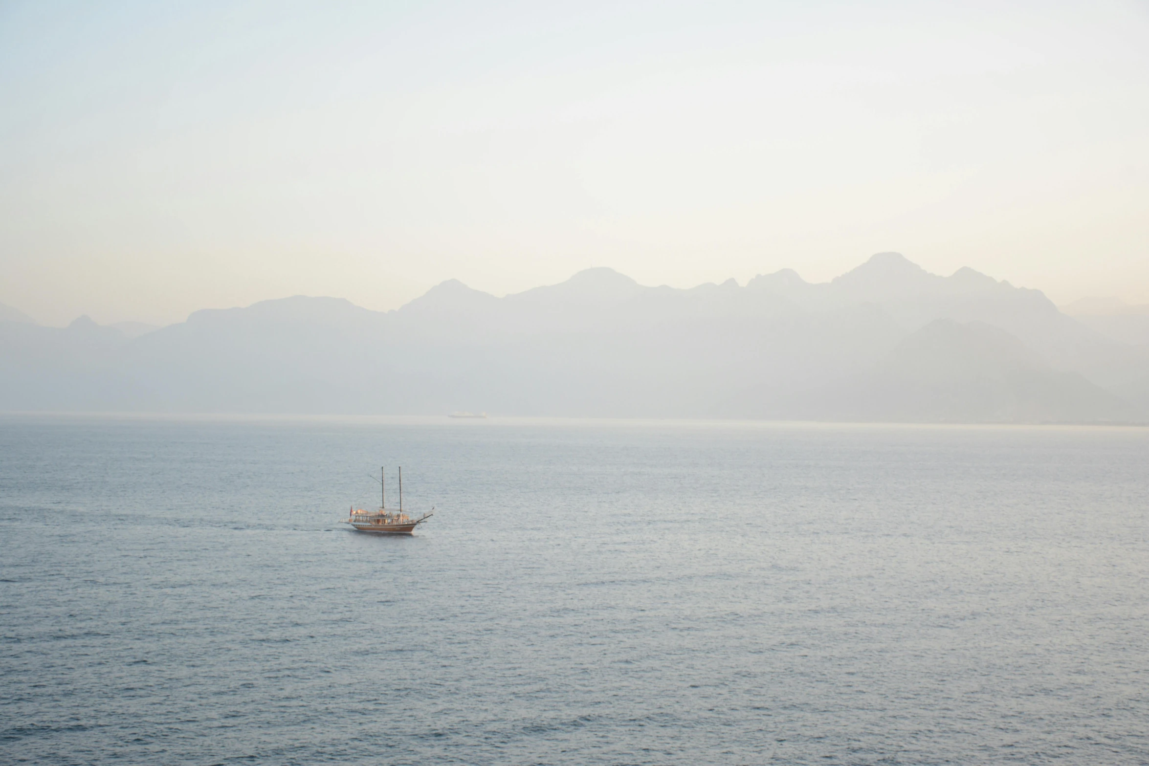 a boat floating on top of a large body of water