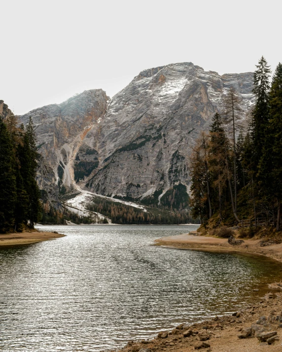 an alpine mountain range is seen in the distance