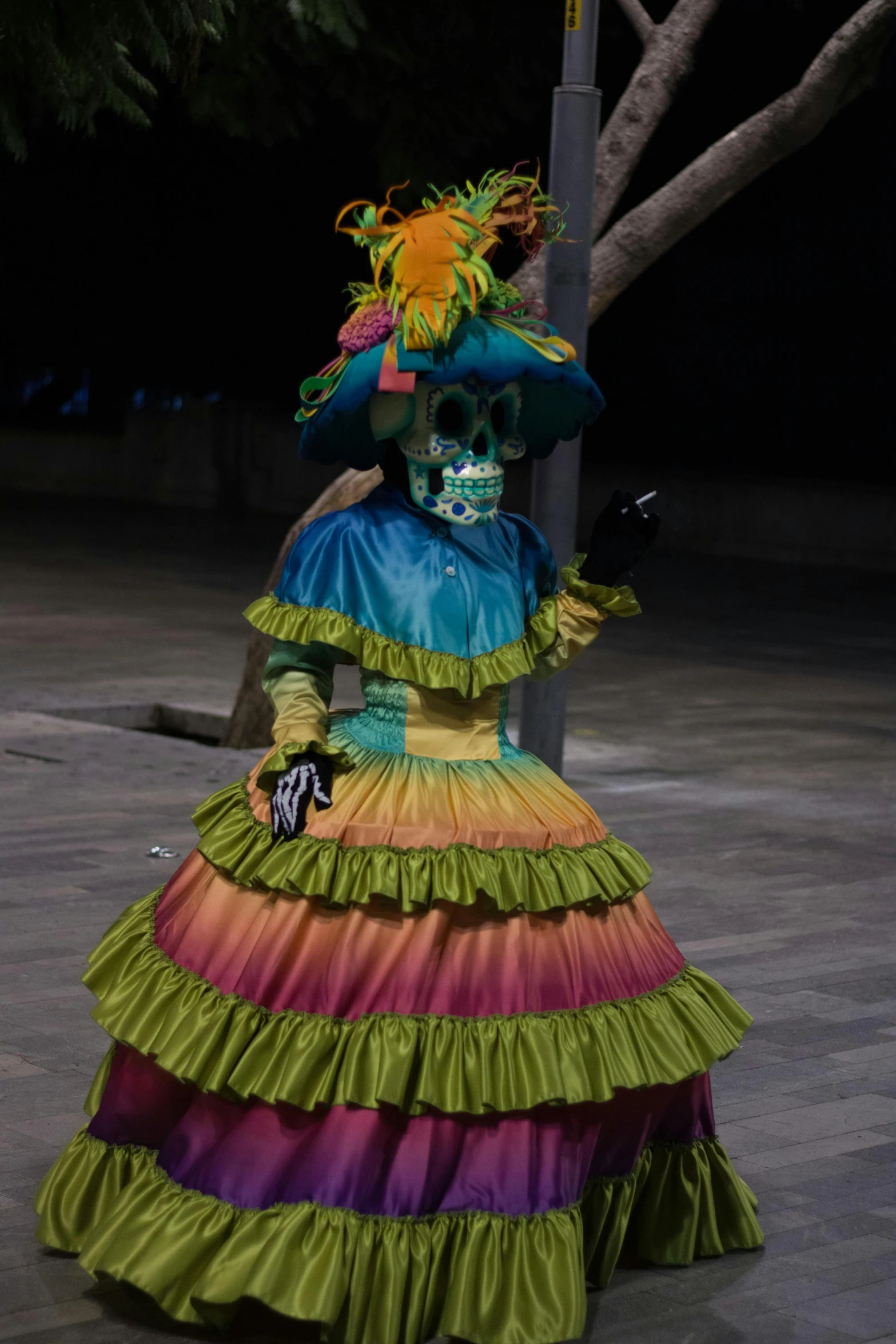 a woman is wearing a colorful dress and a skull headdress