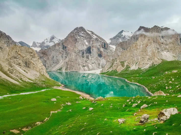 the mountains and valleys are covered in green grass