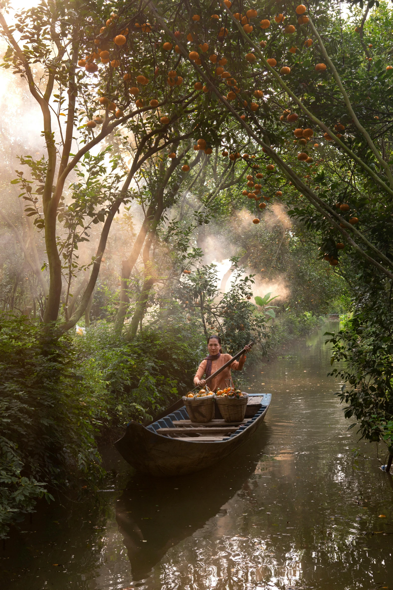 a man in a small boat on a river