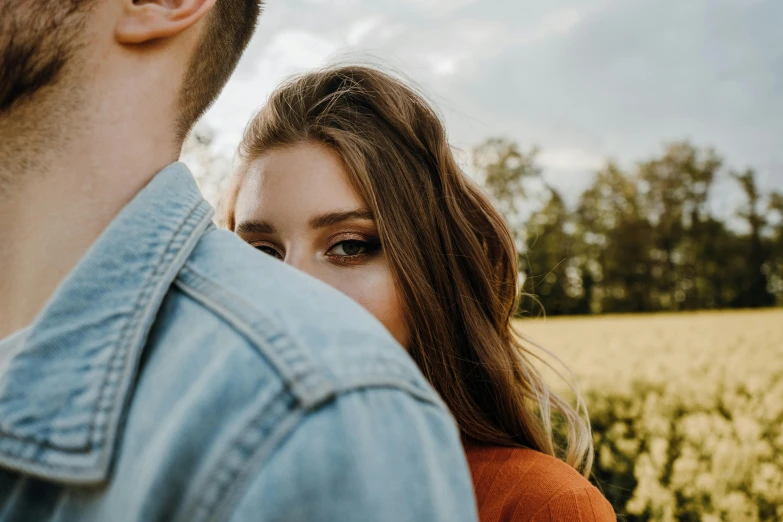 a man and woman who are standing together