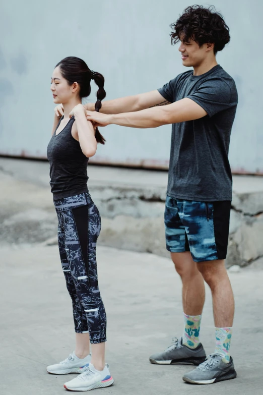 a man helping a woman put on her socks